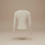Yemelia beige long sleeve fitted crop top with thumbhole cuffs and clean neckline, made from soft stretchy fabric.