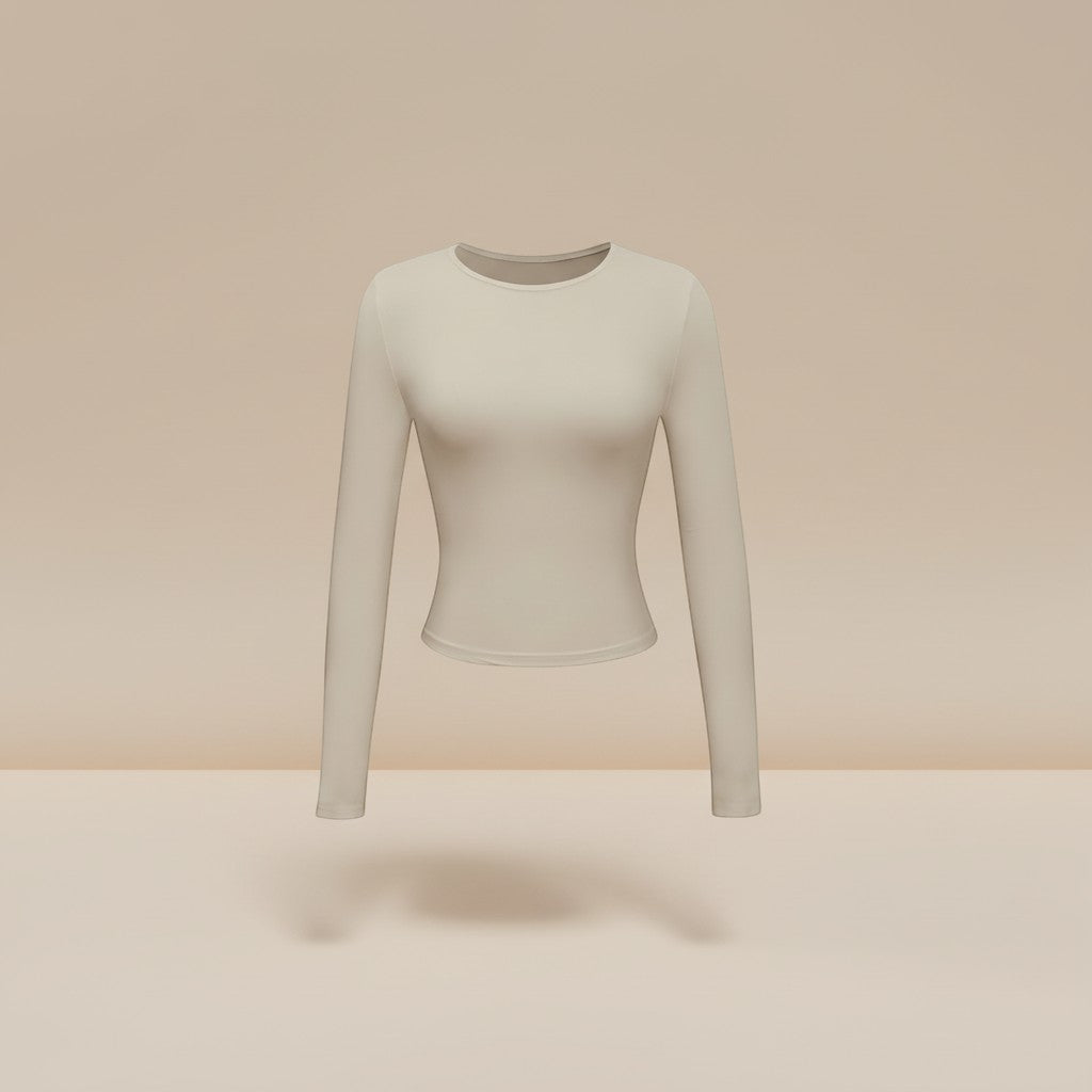 Yemelia beige long sleeve fitted crop top with thumbhole cuffs and crew neck, made from soft stretch fabric.