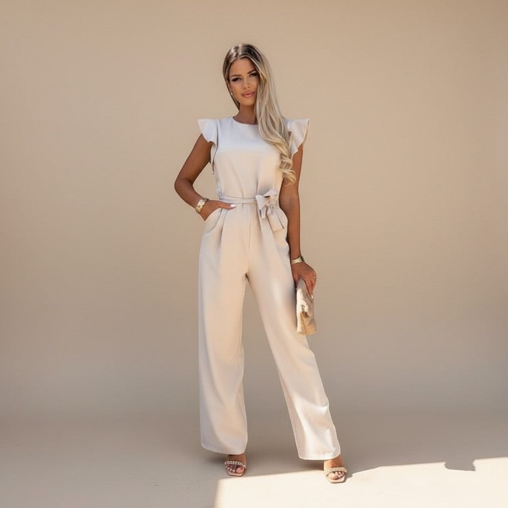 Yemelia beige flutter sleeve wide leg jumpsuit with adjustable waist tie and full-length silhouette.