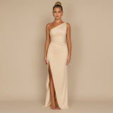 Yemelia beige one shoulder draped evening gown with high slit and sculpted fit. Floor-length formal dress.
