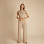 Yemelia sleeveless wide leg jumpsuit in beige with a cinched waist tie and elegant neckline.