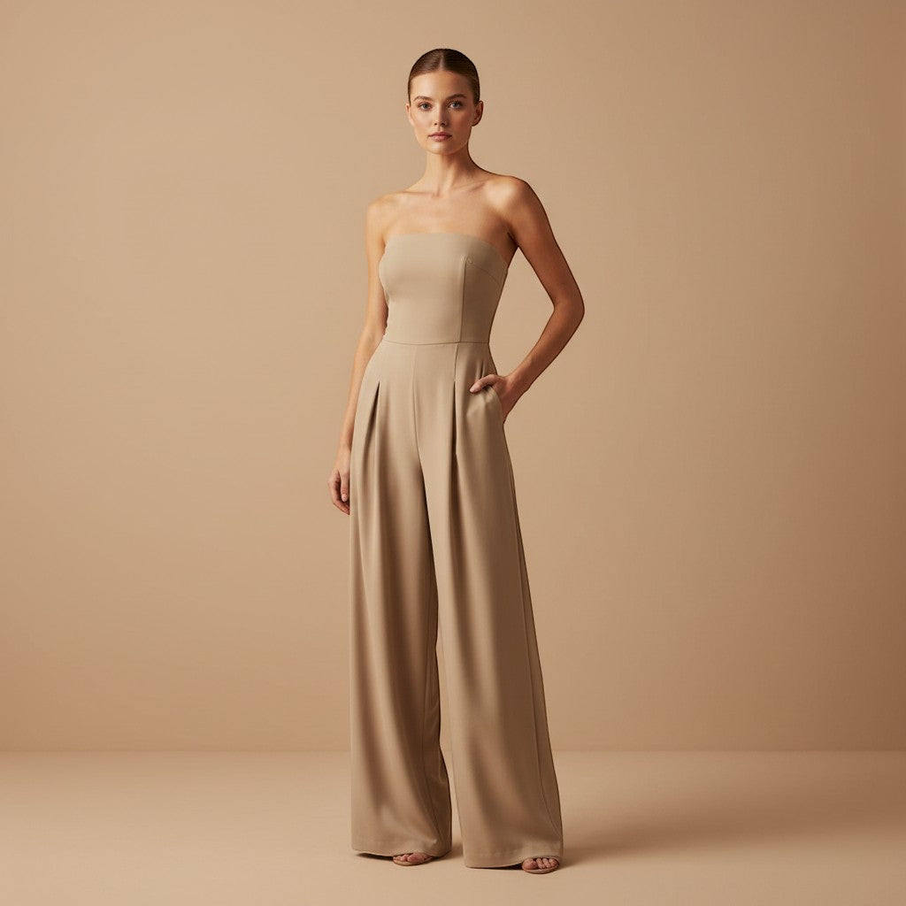 Yemelia beige strapless wide leg jumpsuit with tailored fit and side pockets. Elegant formal wear.