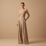 Yemelia beige strapless wide leg jumpsuit with tailored fit and side pockets. Elegant formal wear.