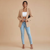 Yemelia beige open front tailored blazer with a modern slim fit and sleek front pockets.