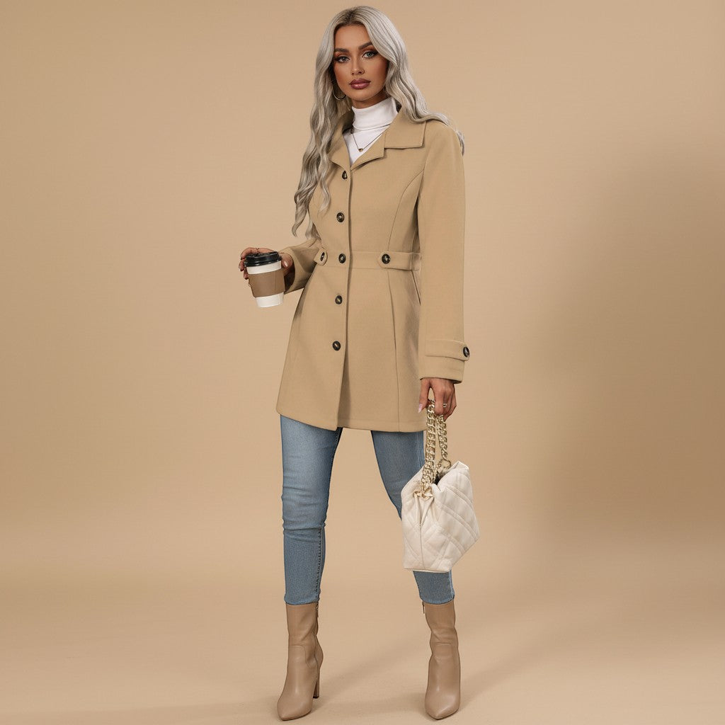 Yemelia beige tailored mid-length coat with button front, classic collar, and waist belt. Structured silhouette for versatile wear.