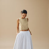 Yemelia beige sleeveless textured knit crop top with clean neckline and structured fit.