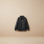 Yemelia black faux leather bomber jacket with zip front, ribbed trim, and contrast stitching. Ideal for casual wear.