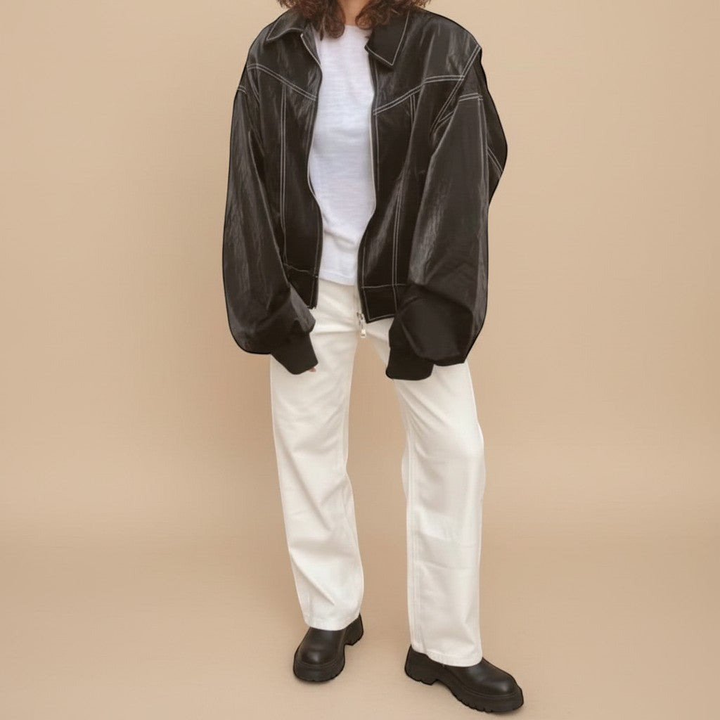 Yemelia black faux leather bomber jacket with white contrast stitching, zip front, and ribbed trim. Ideal for casual wear.