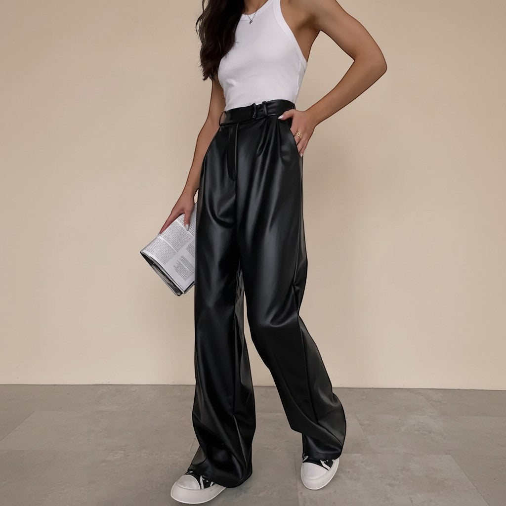 Yemelia black faux leather high waist wide leg pants with belt and side pockets.
