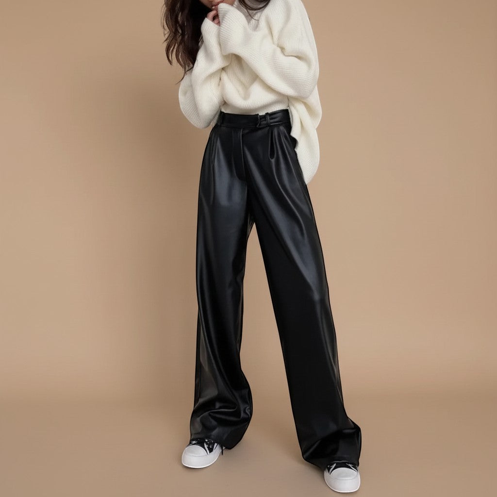 Yemelia black faux leather high waist wide leg pants with belt and side pockets.