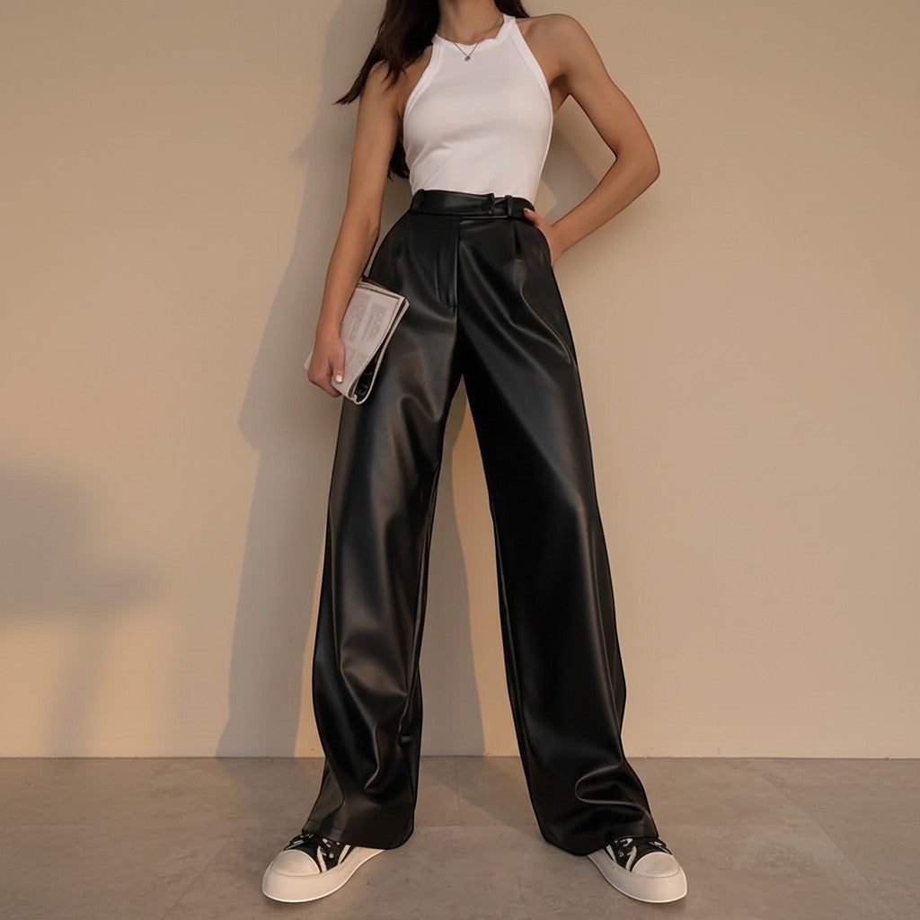 Yemelia black faux leather high waist wide leg pants with belt and side pockets.