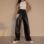 Yemelia black faux leather high waist wide leg pants with belt and side pockets.