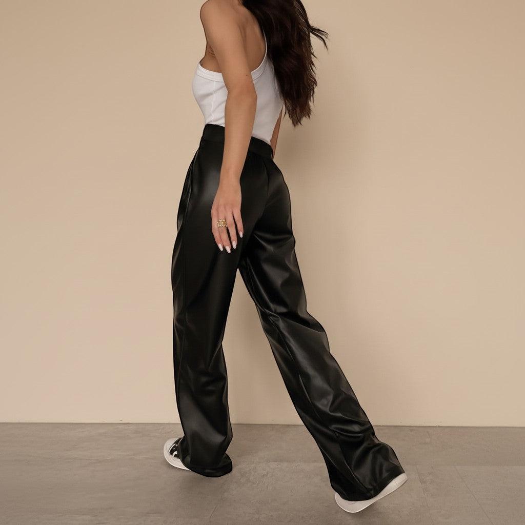 Yemelia black faux leather high waist wide leg pants with belt and side pockets.