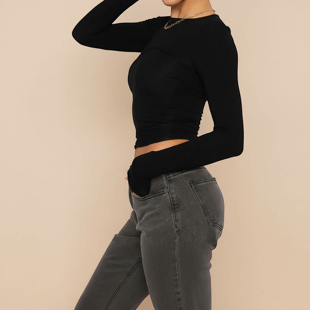 Yemelia black long sleeve fitted crop top with thumbhole cuffs and a clean neckline, made from soft stretchy fabric.