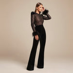 Yemelia black lace jumpsuit with feather cuffs, structured shoulders, and flared velvet pants. Elegant evening wear.