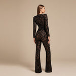 Yemelia black lace sequin jumpsuit with long sleeves, structured waist, and wide legs. Ideal for formal events.