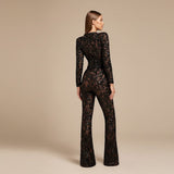 Yemelia black lace sequin jumpsuit with long sleeves, structured waist, and wide legs. Ideal for formal events.