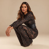 Yemelia black lace sequin jumpsuit with long sleeves, structured waist, and wide legs. Perfect for evening events.