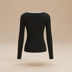 Yemelia black ribbed long sleeve top with contrast trim V-neck and hem. Soft, stretchy fabric.