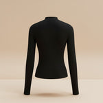 Yemelia black long sleeve fitted top with asymmetrical neckline and ruched detailing, made from stretch fabric.