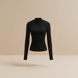 Yemelia black long sleeve fitted top with asymmetrical neckline and ruched detailing, made from stretch fabric.