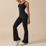 Yemelia black sleeveless sculpting flared leg jumpsuit with a clean neckline and subtle side cut-outs. Made from smooth, stretch fabric.