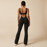 Yemelia black sleeveless sculpting flared leg jumpsuit with ruched detail on the back.