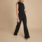 Yemelia black sleeveless wide leg jumpsuit with a tie waist and high neckline. Elegant and tailored for formal events or workwear.