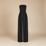 Yemelia black strapless wide leg jumpsuit with tailored fit and side pockets. Elegant formal wear.