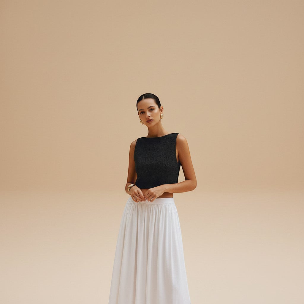 Yemelia black sleeveless textured crop top with clean neckline, perfect for casual wear.