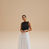 Yemelia black sleeveless textured crop top with clean neckline, perfect for casual wear.