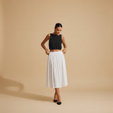 Yemelia black sleeveless textured crop top with clean neckline, perfect for casual wear.