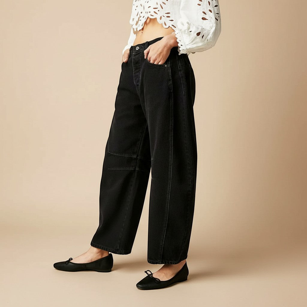 Yemelia black denim wide leg jeans with relaxed fit and five-pocket styling.