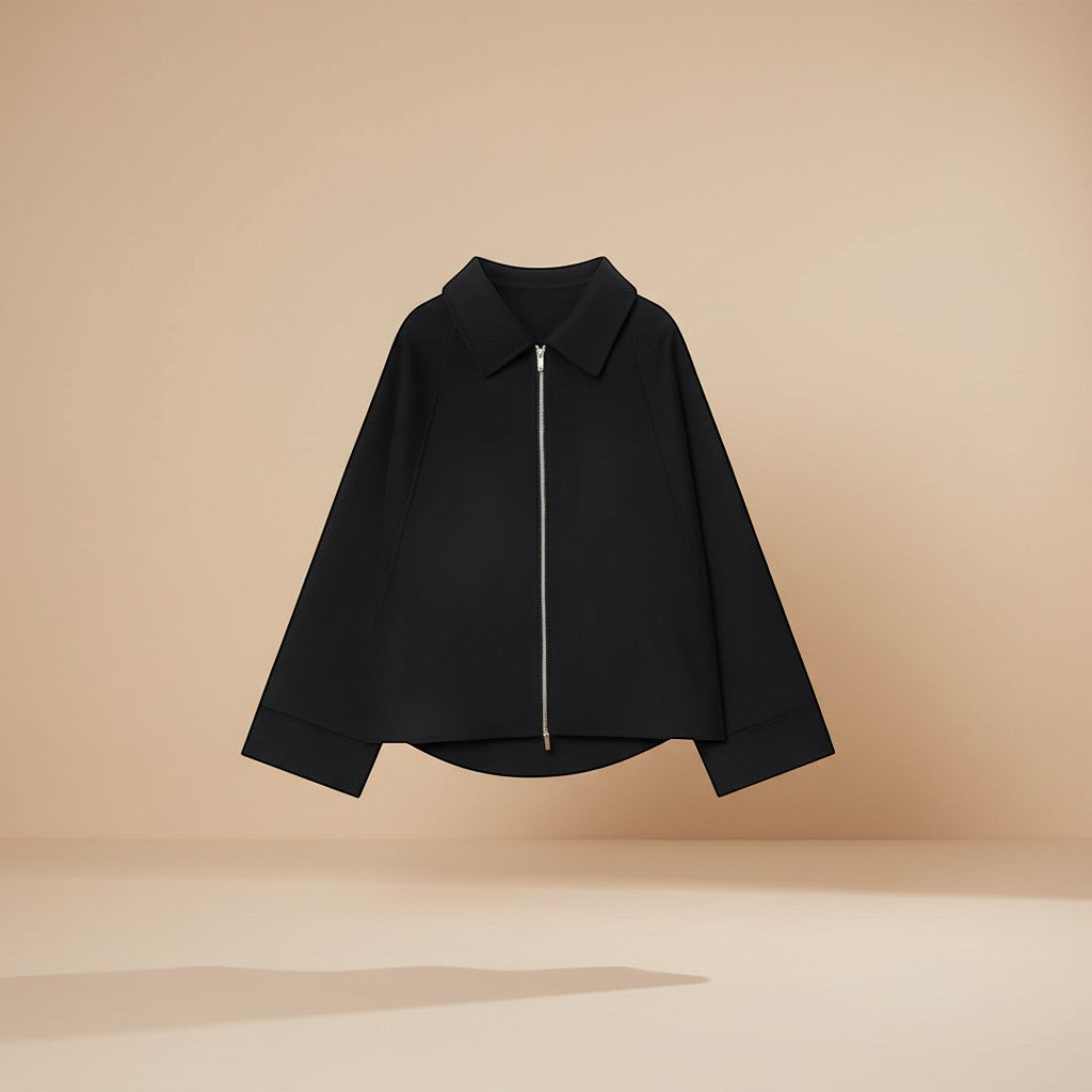 Yemelia black minimal zip front jacket with a relaxed fit and classic collar. Structured fabric.