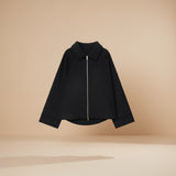 Yemelia black minimal zip front jacket with a relaxed fit and classic collar. Structured fabric.