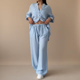Yemelia light blue relaxed fit button-down shirt and wide-leg pants set, lightweight textured fabric, drawstring waist.