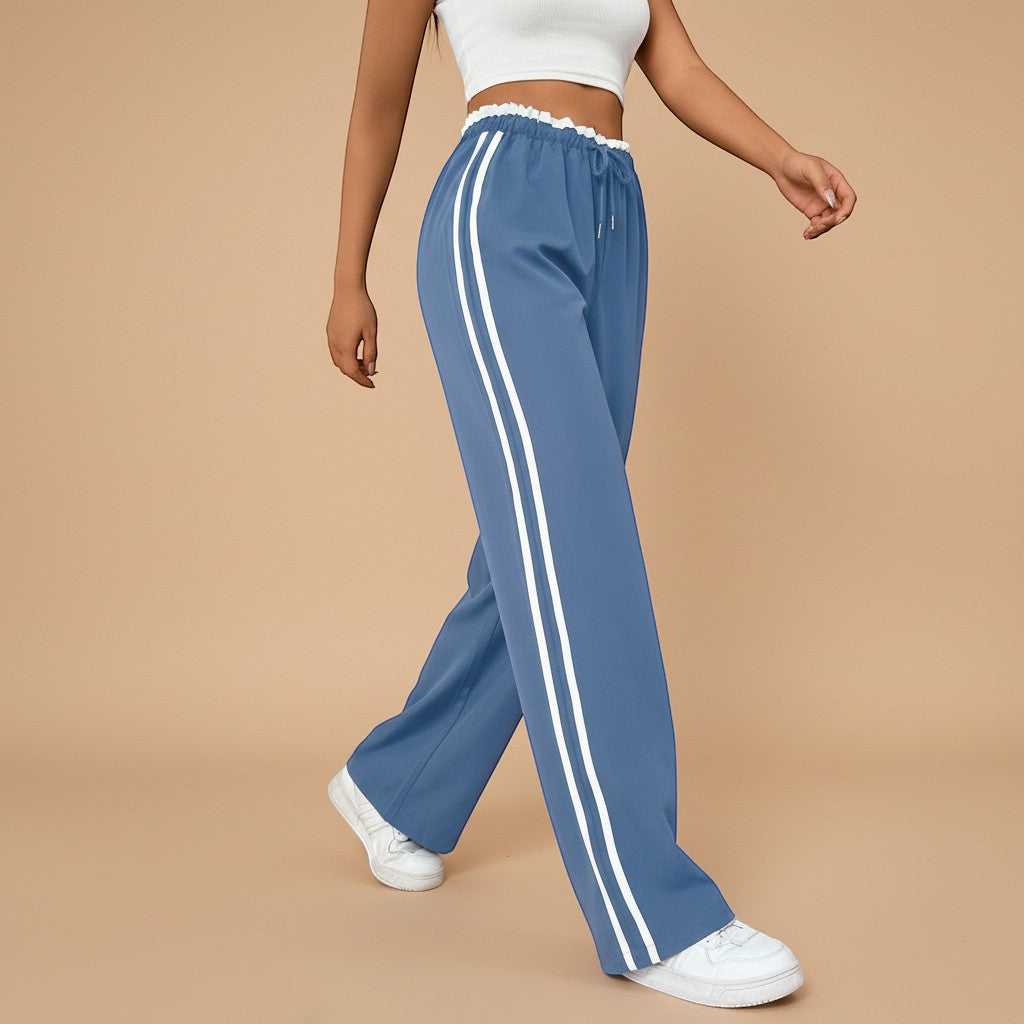 Yemelia blue high waist wide leg track pants with white side stripe detail and elastic waistband.
