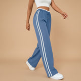 Yemelia blue high waist wide leg track pants with white side stripe detail and elastic waistband.
