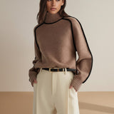 Yemelia brown knit turtleneck sweater with black contrast trim detailing on shoulders and sleeves. Ribbed cuffs and hem.