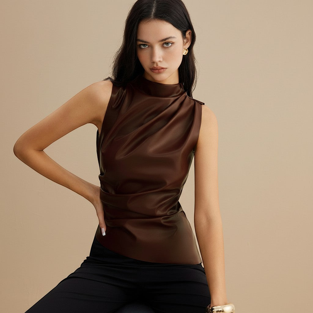 Yemelia sleeveless brown faux leather draped high neck top with a fitted silhouette.