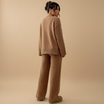 Yemelia brown knit lounge set with relaxed fit sweater and wide leg pants, featuring ribbed details.