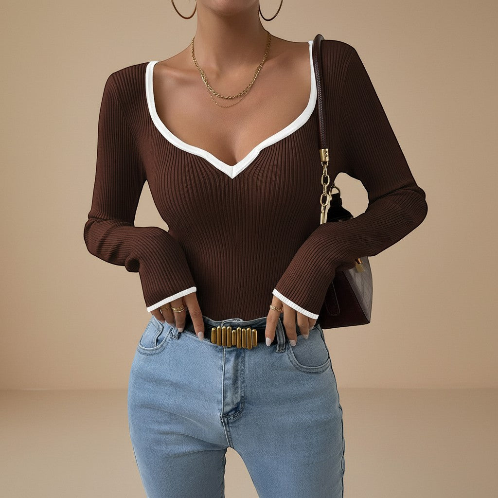 Yemelia brown ribbed long sleeve top with white contrast trim V-neck and cuffs, fitted silhouette.
