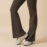 Yemelia sleeveless brown sculpting flared leg jumpsuit made of smooth, stretch fabric.