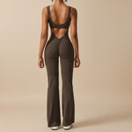 Yemelia sleeveless brown sculpting flared leg jumpsuit with ruched detail and open back.