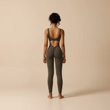 Yemelia sleeveless brown sculpting flared leg jumpsuit with ruched back detail and open back.