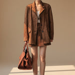 Yemelia brown suede relaxed fit button front blazer with notched lapels and flap pockets.