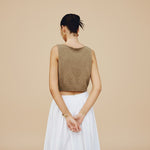 Yemelia sleeveless brown textured crop top with clean neckline, perfect for casual wear.