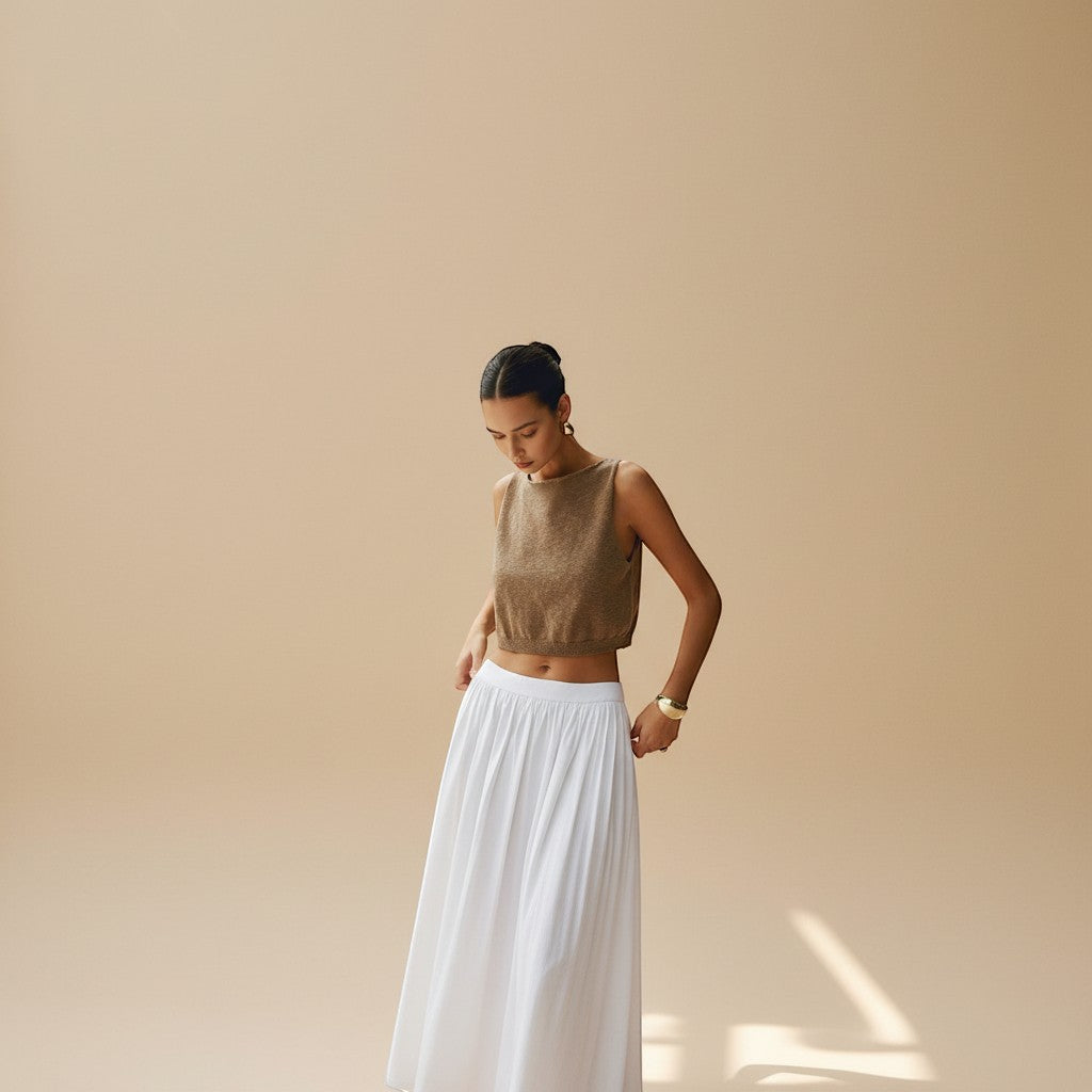 Yemelia brown sleeveless textured knit crop top with clean neckline and ribbed hem.