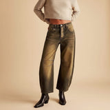 Yemelia brown and tan washed denim wide leg jeans with relaxed fit and mid-rise waist.