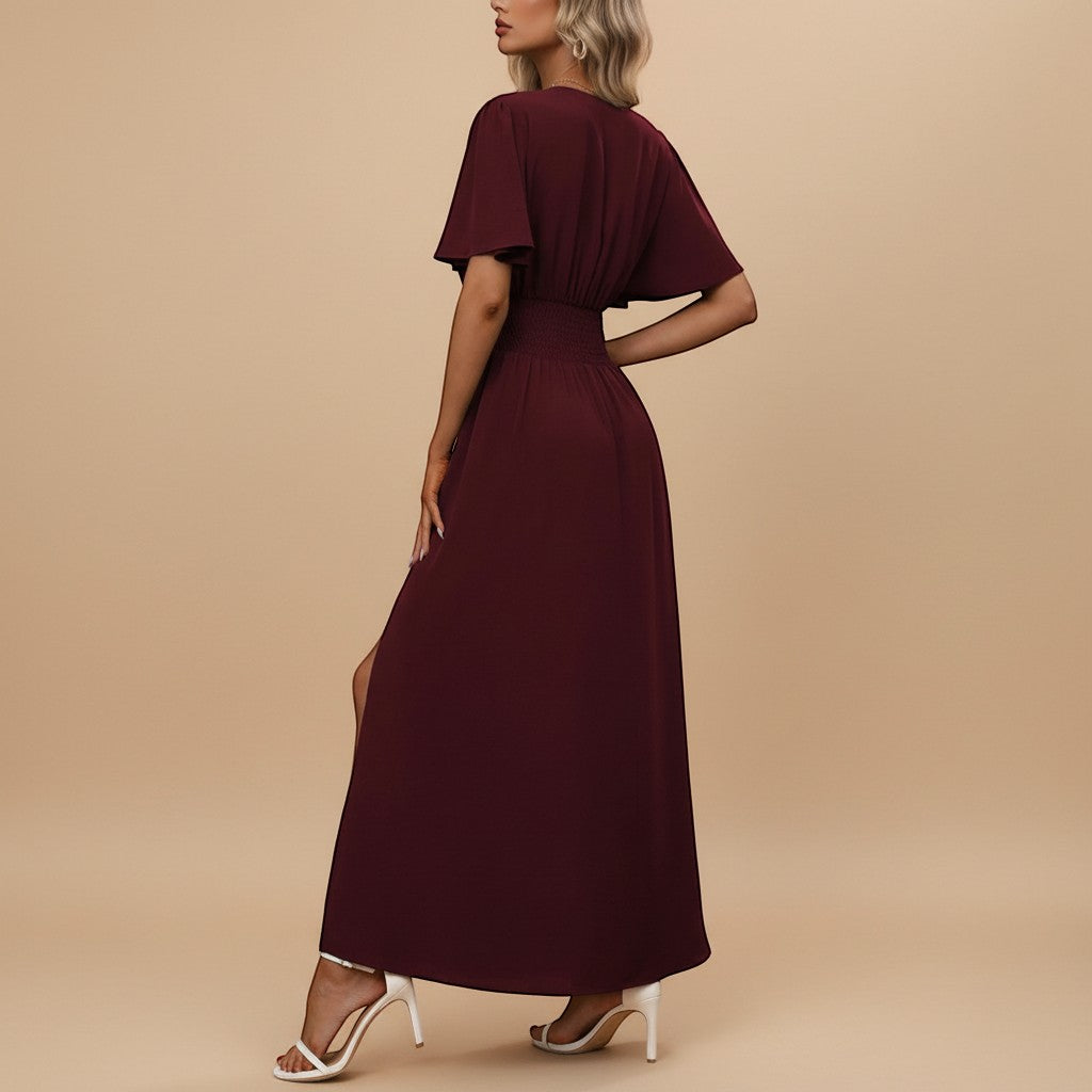 Yemelia burgundy V neck flutter sleeve maxi dress with defined waist and side slit.